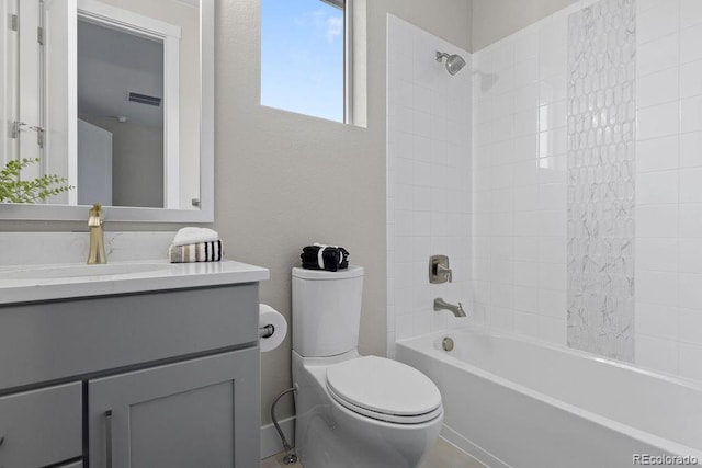 full bath with visible vents, vanity, toilet, and bathing tub / shower combination