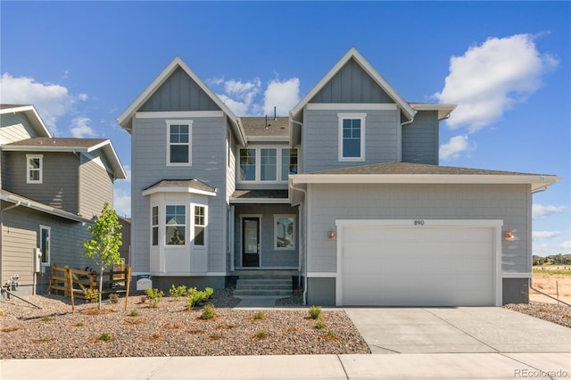 view of front of house featuring a garage, fence, board and batten siding, and concrete driveway