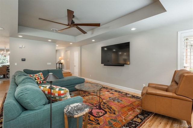 5164 E Princeton Ave, Cherry Hills Village, CO 80113 - living room featuring wood finished floors, a raised ceiling, baseboards, ceiling fan with notable chandelier, and recessed lighting