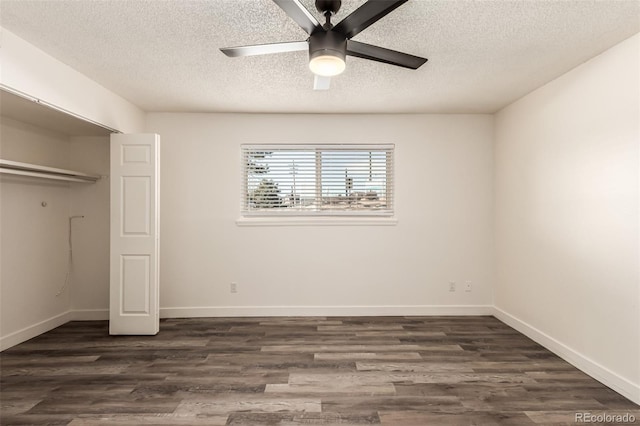 unfurnished bedroom featuring dark hardwood / wood-style flooring, ceiling fan, a closet, and a textured ceiling