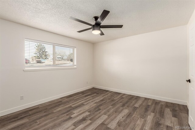 unfurnished room with ceiling fan, dark hardwood / wood-style floors, and a textured ceiling