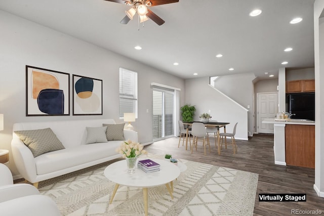 living room featuring recessed lighting, ceiling fan, baseboards, and dark wood-type flooring