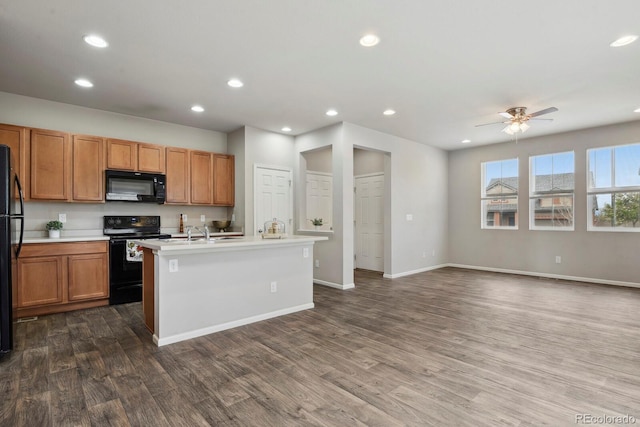 kitchen featuring recessed lighting, ceiling fan, dark wood-style floors, and black appliances