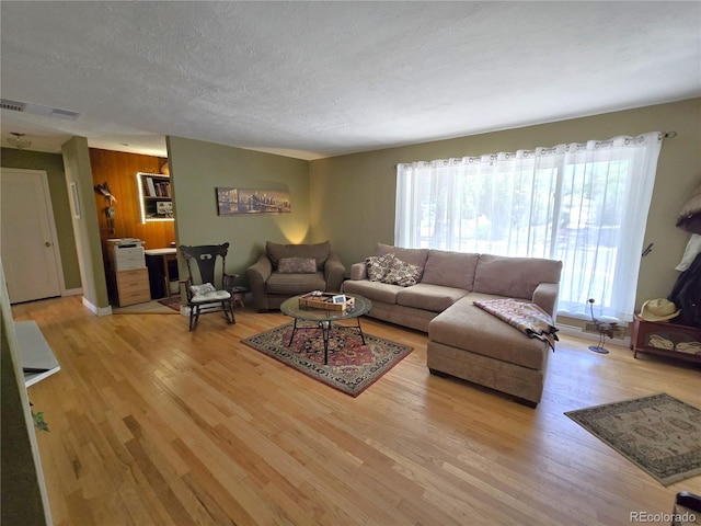 1245 S Forest St, Denver, CO 80246 - living room with wood finished floors and a textured ceiling
