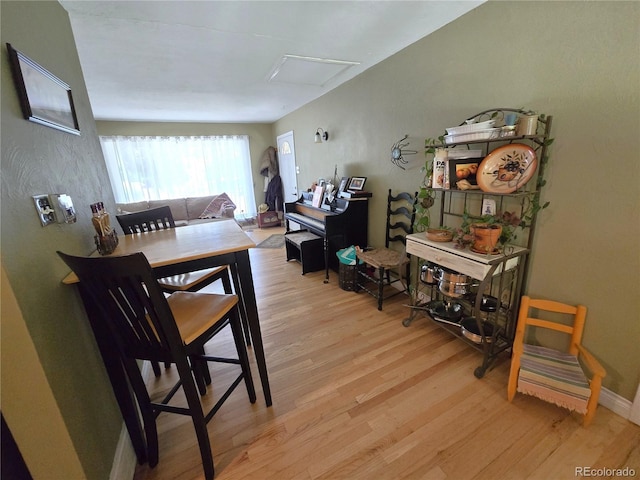 1245 S Forest St, Denver, CO 80246 - dining space with light wood-type flooring and attic access