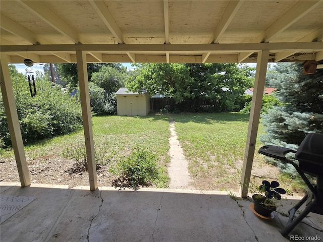 1245 S Forest St, Denver, CO 80246 - view of grassy yard with a patio and a storage unit
