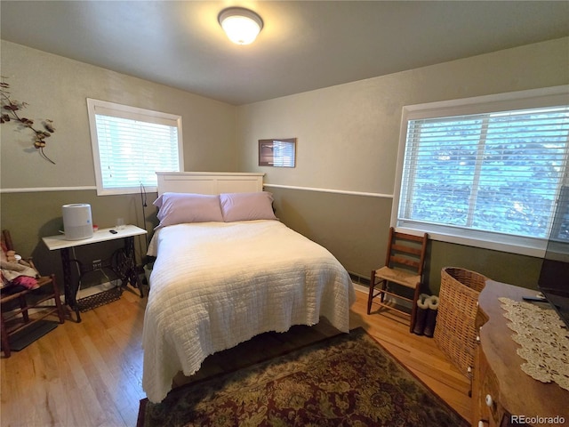 1245 S Forest St, Denver, CO 80246 - bedroom featuring light wood-style floors