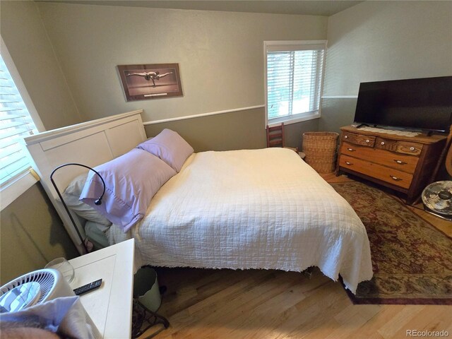 1245 S Forest St, Denver, CO 80246 - bedroom featuring wood finished floors