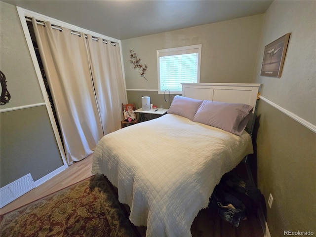 1245 S Forest St, Denver, CO 80246 - bedroom with wood finished floors and baseboards