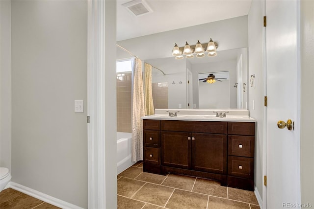 1895 Sage Grouse Ln, Colorado Springs, CO 80951 - bathroom with shower / bath combination with curtain, toilet, double vanity, a ceiling fan, and baseboards