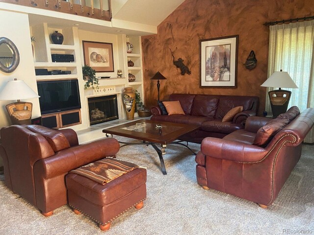 living room with carpet floors, built in shelves, and vaulted ceiling