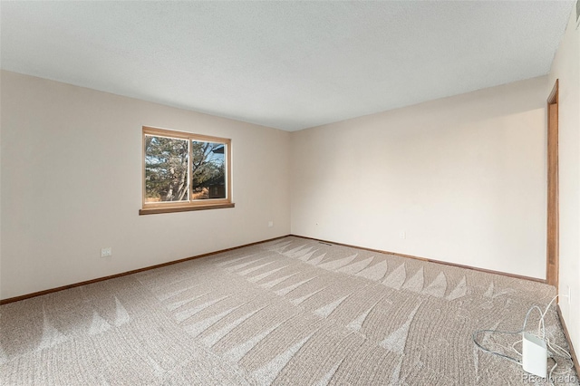 unfurnished room with carpet flooring