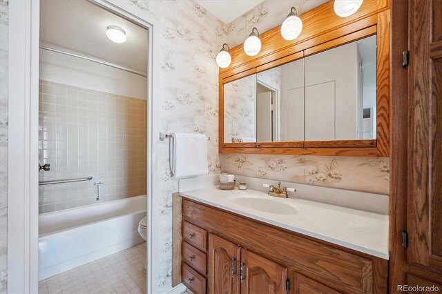 full bathroom with tub / shower combination, wallpapered walls, toilet, and vanity