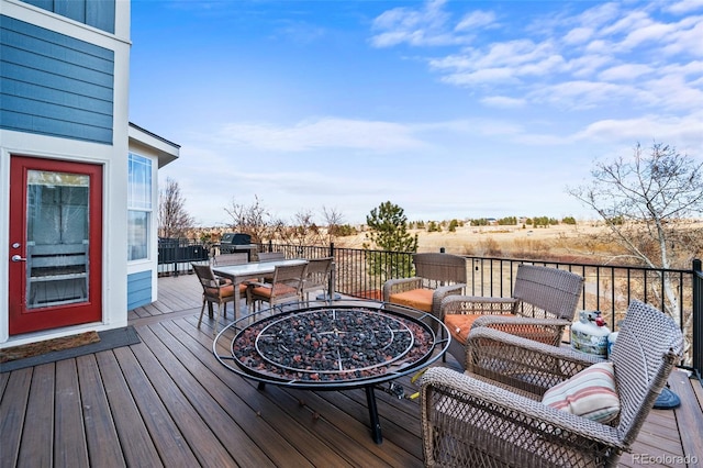 wooden deck featuring outdoor dining area