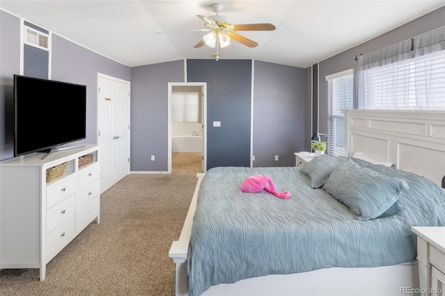 bedroom with visible vents, light carpet, connected bathroom, lofted ceiling, and ceiling fan