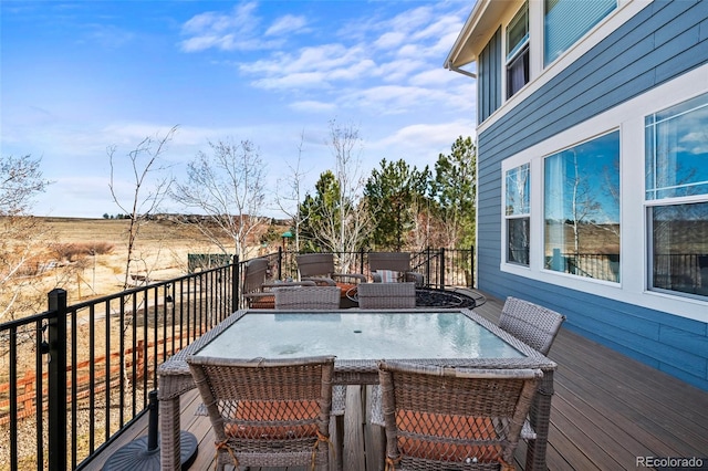 wooden deck with outdoor dining space