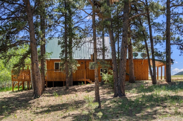 546 Pulver Rd, Lake George, CO 80827 - view of property exterior with a deck and a metal roof