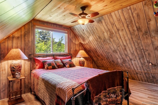 546 Pulver Rd, Lake George, CO 80827 - bedroom featuring lofted ceiling, wooden walls, wood ceiling, light wood-type flooring, and ceiling fan