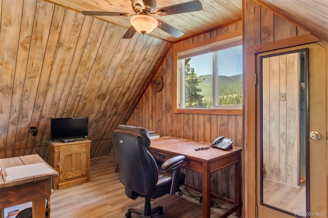 546 Pulver Rd, Lake George, CO 80827 - office featuring vaulted ceiling, wood ceiling, light wood-style flooring, a ceiling fan, and wooden walls