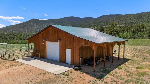 546 Pulver Rd, Lake George, CO 80827 - view of outbuilding with a mountain view, a wooded view, and driveway