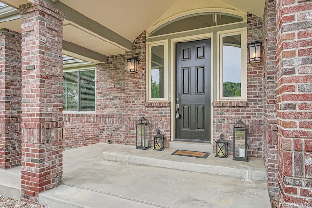 7400 S Genoa Cir, Centennial, CO 80016 - property entrance featuring a porch and brick siding