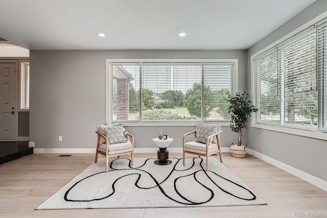 7400 S Genoa Cir, Centennial, CO 80016 - living area with healthy amount of natural light, light wood-style floors, and recessed lighting