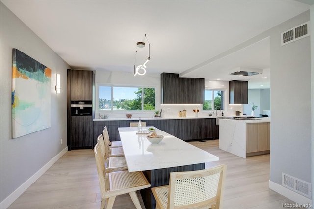 7400 S Genoa Cir, Centennial, CO 80016 - dining space with light wood-style floors and recessed lighting