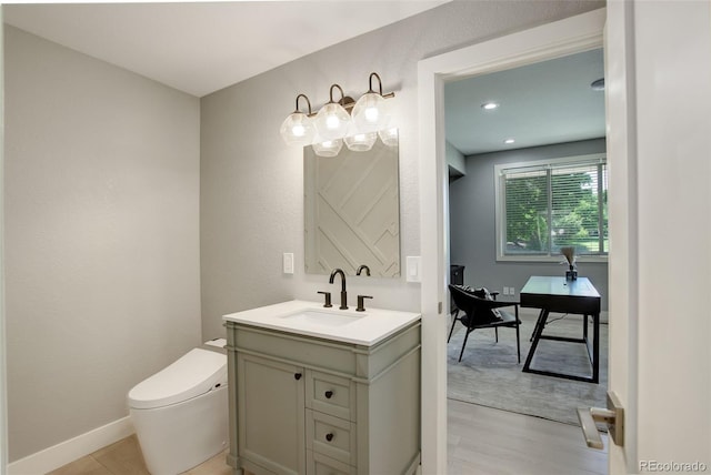 7400 S Genoa Cir, Centennial, CO 80016 - bathroom featuring vanity and wood finished floors