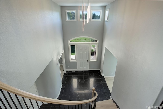 7400 S Genoa Cir, Centennial, CO 80016 - foyer entrance with a high ceiling and stairs