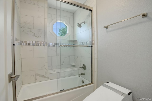 7400 S Genoa Cir, Centennial, CO 80016 - bathroom with combined bath / shower with glass door and a textured wall