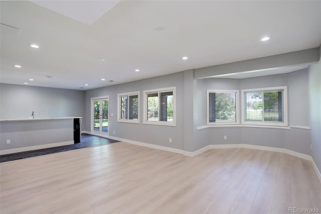 7400 S Genoa Cir, Centennial, CO 80016 - unfurnished living room featuring light wood-style floors and recessed lighting