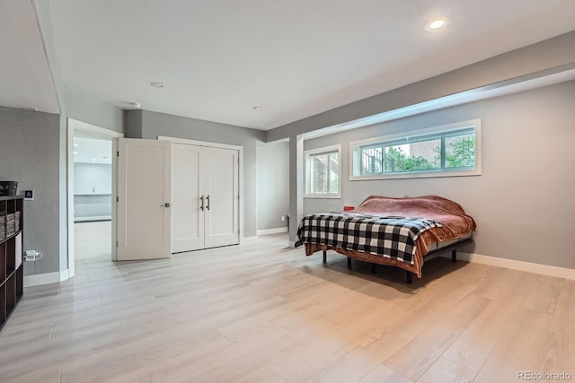 7400 S Genoa Cir, Centennial, CO 80016 - bedroom featuring light wood-style flooring, recessed lighting, and a closet