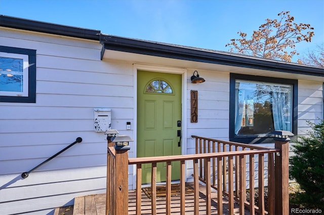 doorway to property with a wooden deck