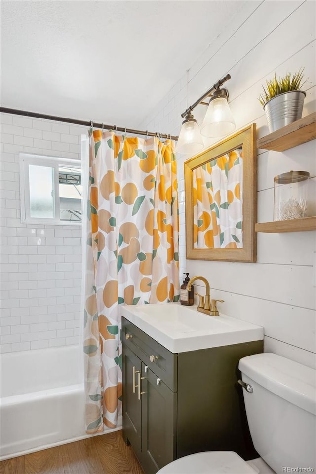 full bathroom featuring vanity, shower / bath combo, and toilet