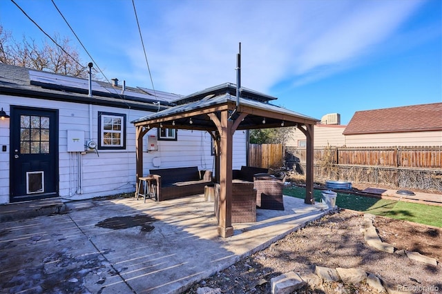 view of patio featuring an outdoor living space and a gazebo