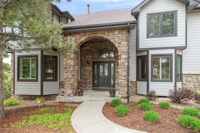 920 Shady Oak Ln, Castle Pines, CO 80108 - entrance to property featuring stone siding and a shingled roof