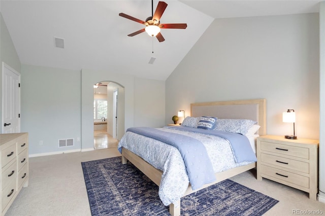 920 Shady Oak Ln, Castle Pines, CO 80108 - bedroom featuring arched walkways, lofted ceiling, light colored carpet, ensuite bathroom, and ceiling fan