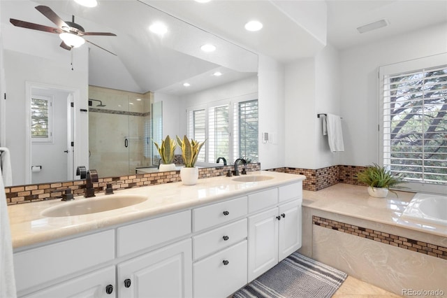 920 Shady Oak Ln, Castle Pines, CO 80108 - bathroom with a shower stall, double vanity, a garden tub, recessed lighting, and ceiling fan