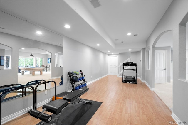 920 Shady Oak Ln, Castle Pines, CO 80108 - workout room with arched walkways, light wood-style floors, recessed lighting, and baseboards