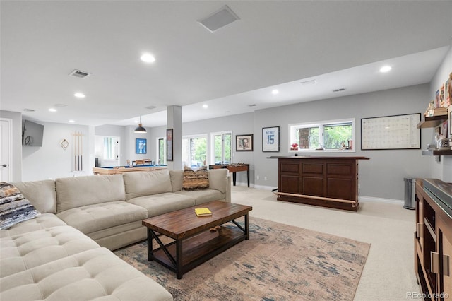 920 Shady Oak Ln, Castle Pines, CO 80108 - living area featuring recessed lighting, light carpet, baseboards, and bar area
