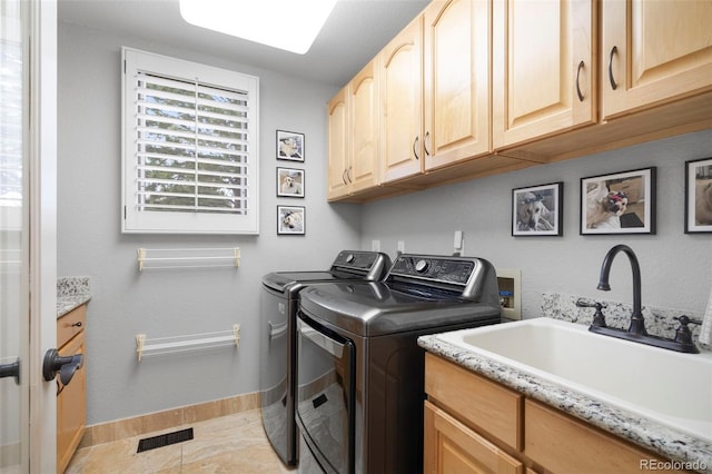 920 Shady Oak Ln, Castle Pines, CO 80108 - laundry area with washer and clothes dryer, cabinet space, baseboards, and light tile patterned flooring