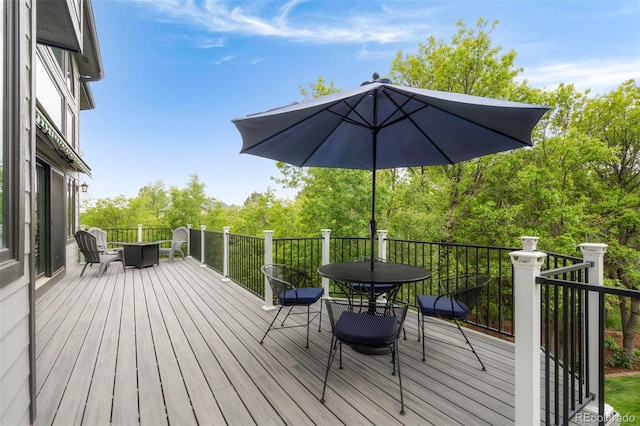 920 Shady Oak Ln, Castle Pines, CO 80108 - wooden deck with outdoor dining space