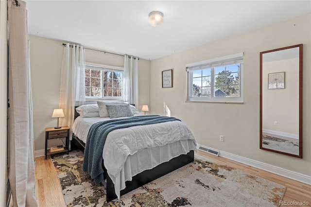 bedroom featuring light wood-type flooring