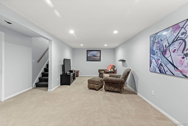 living area featuring light colored carpet