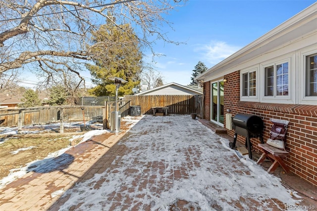 view of yard layered in snow