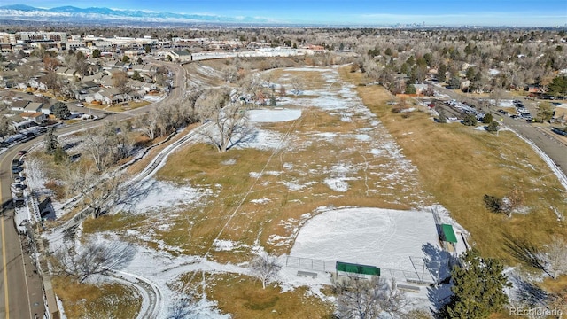 snowy aerial view with a mountain view