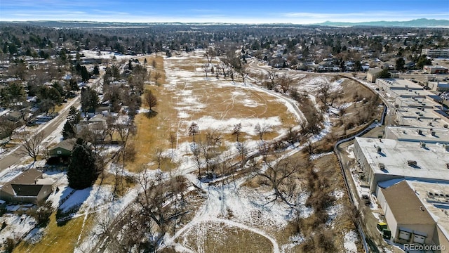 snowy aerial view featuring a mountain view