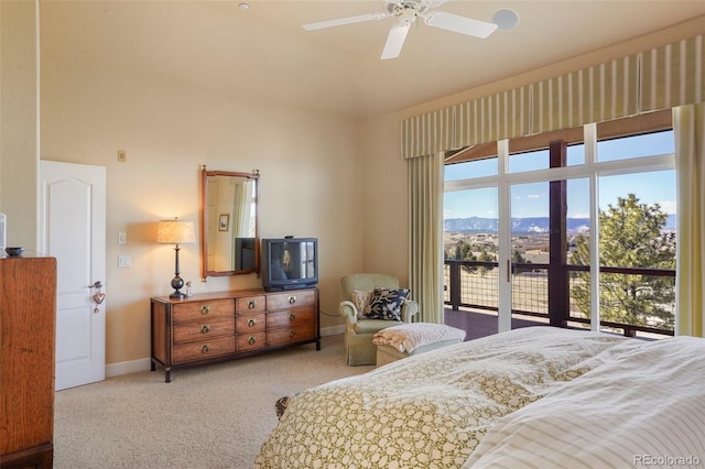 carpeted bedroom featuring ceiling fan and baseboards