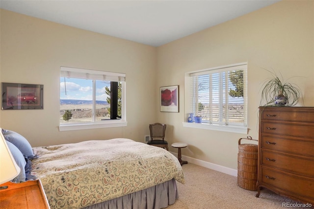 bedroom featuring carpet flooring and baseboards