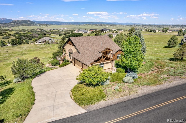 drone / aerial view featuring a mountain view